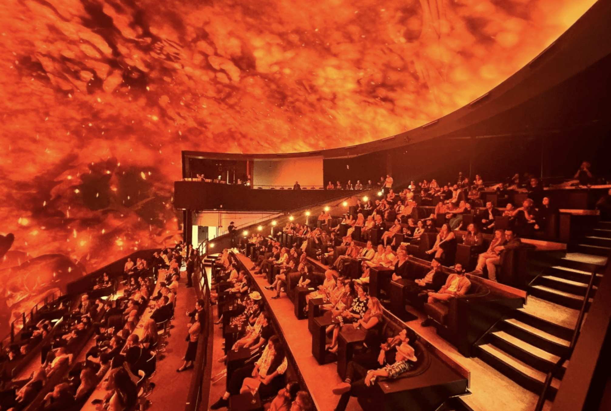 A domed theater showing a fiery scene